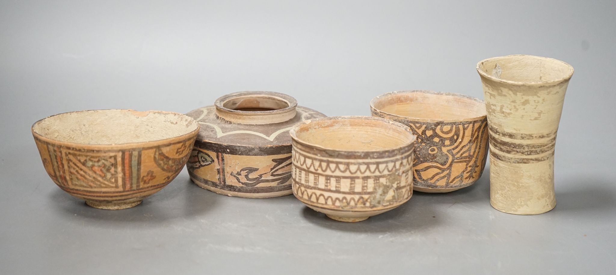 Five Indus Valley pottery vessels, neolithic, tallest 11cm
